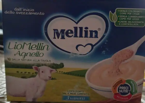 Confezione di Mellin Agnello, liofilizzato di carne per lo svezzamento, con un agnellino e una ciotola di pappa.